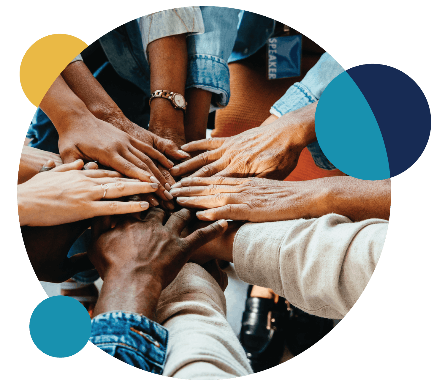 Hands stacked together in a gesture of teamwork and community.