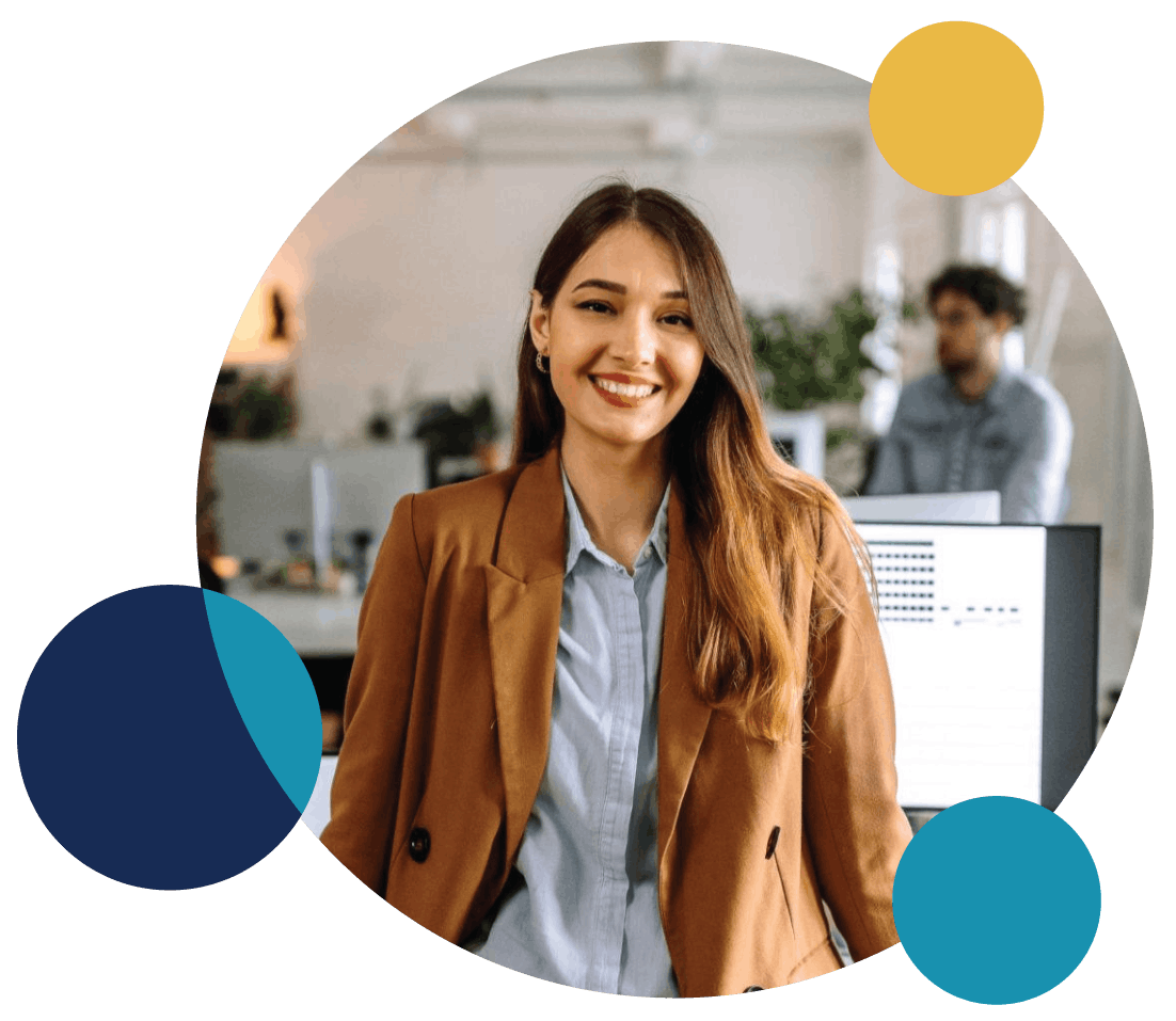 Professional woman smiling in a modern office setting.