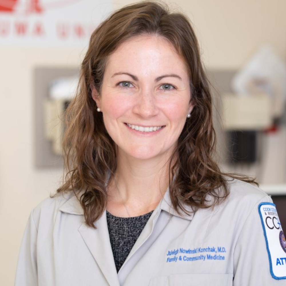 Professional headshot of a smiling woman.