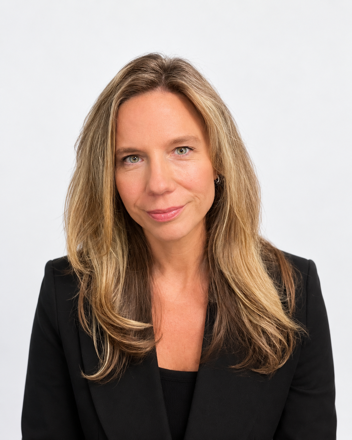 Professional headshot of a smiling woman with long blonde hair.