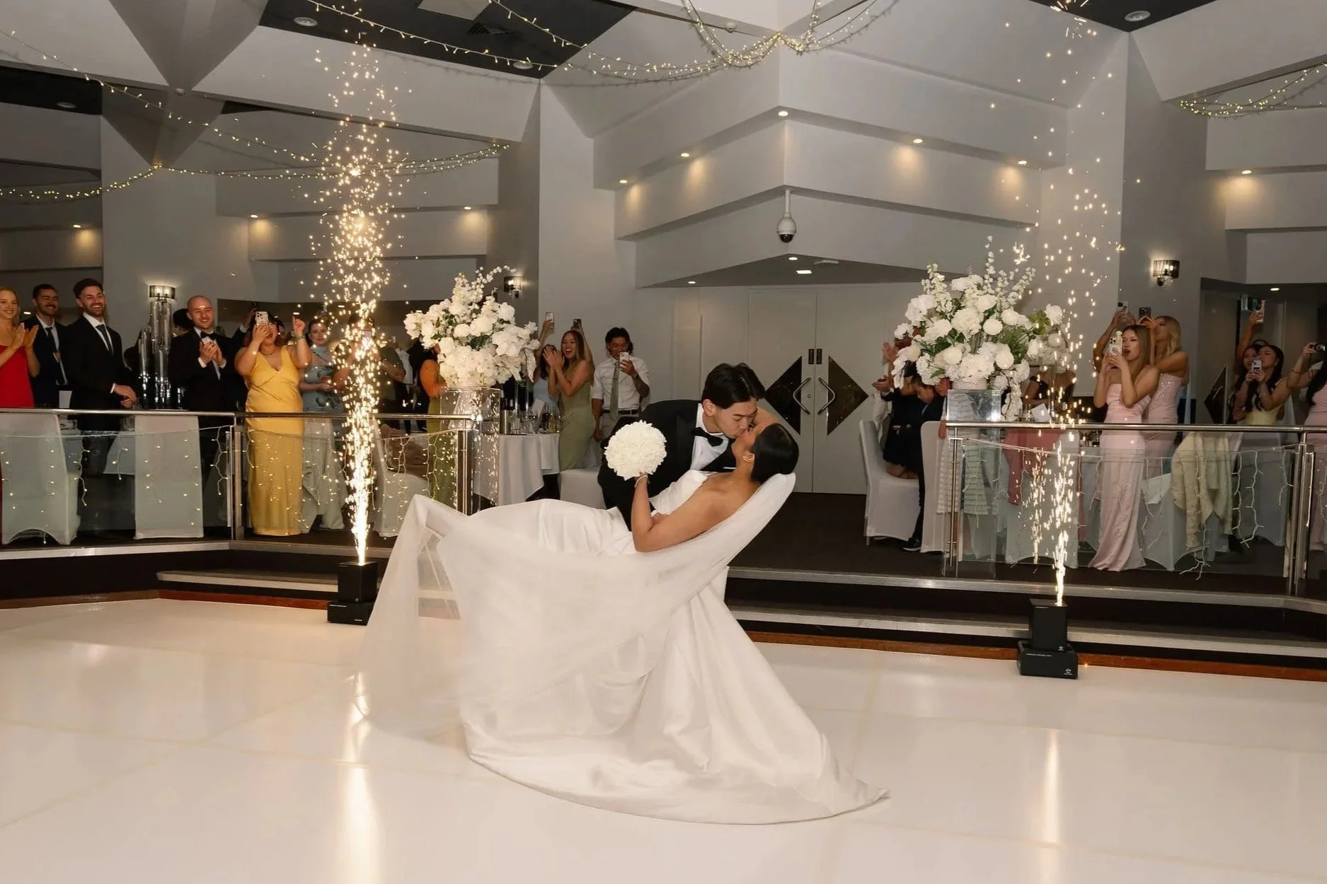 Bride and groom celebrating their wedding at Donato Reception Centre, a luxury wedding venue in Adelaide.