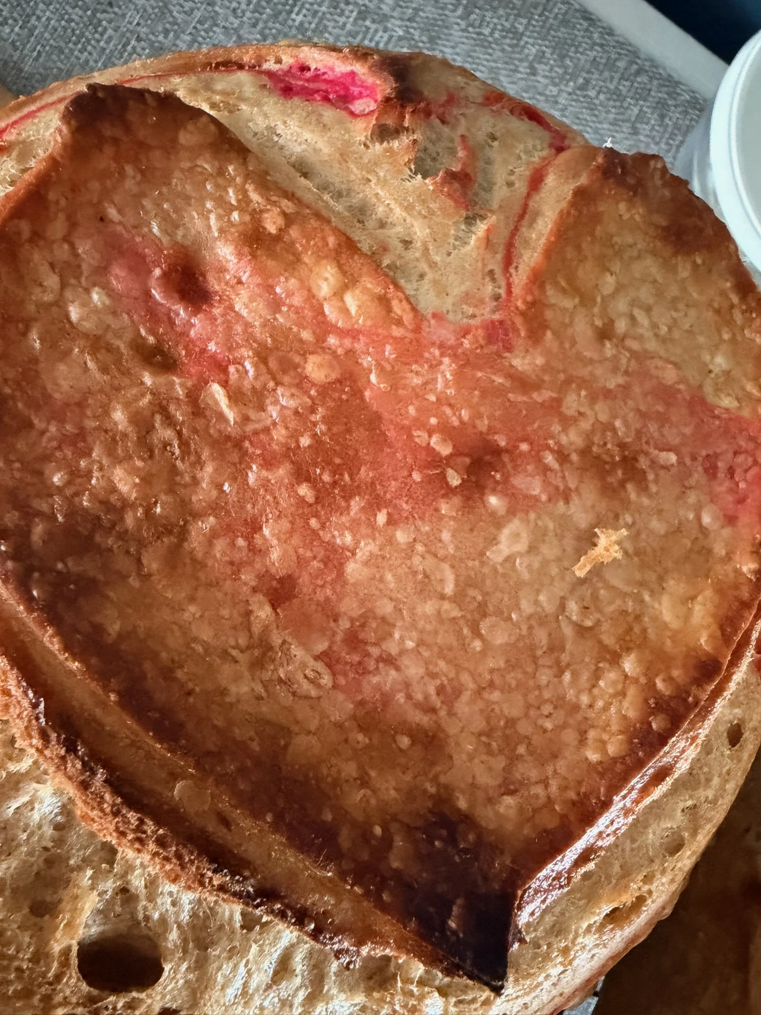 Swirl pink dyed sourdough loaf made to perfection! Check out the heart score!