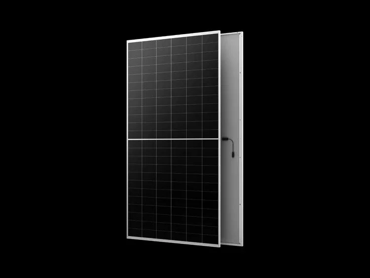 A black solar panel with a silver frame, mounted on a black background.