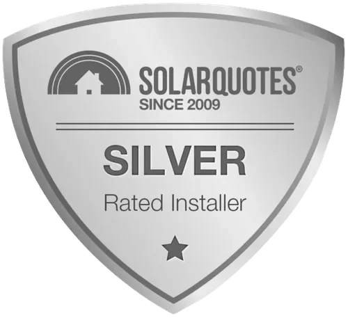 A grayscale badge with the SolarQuotes logo, a house with a rainbow, and the text "Since 2009, Silver, Rated Installer" and a star.