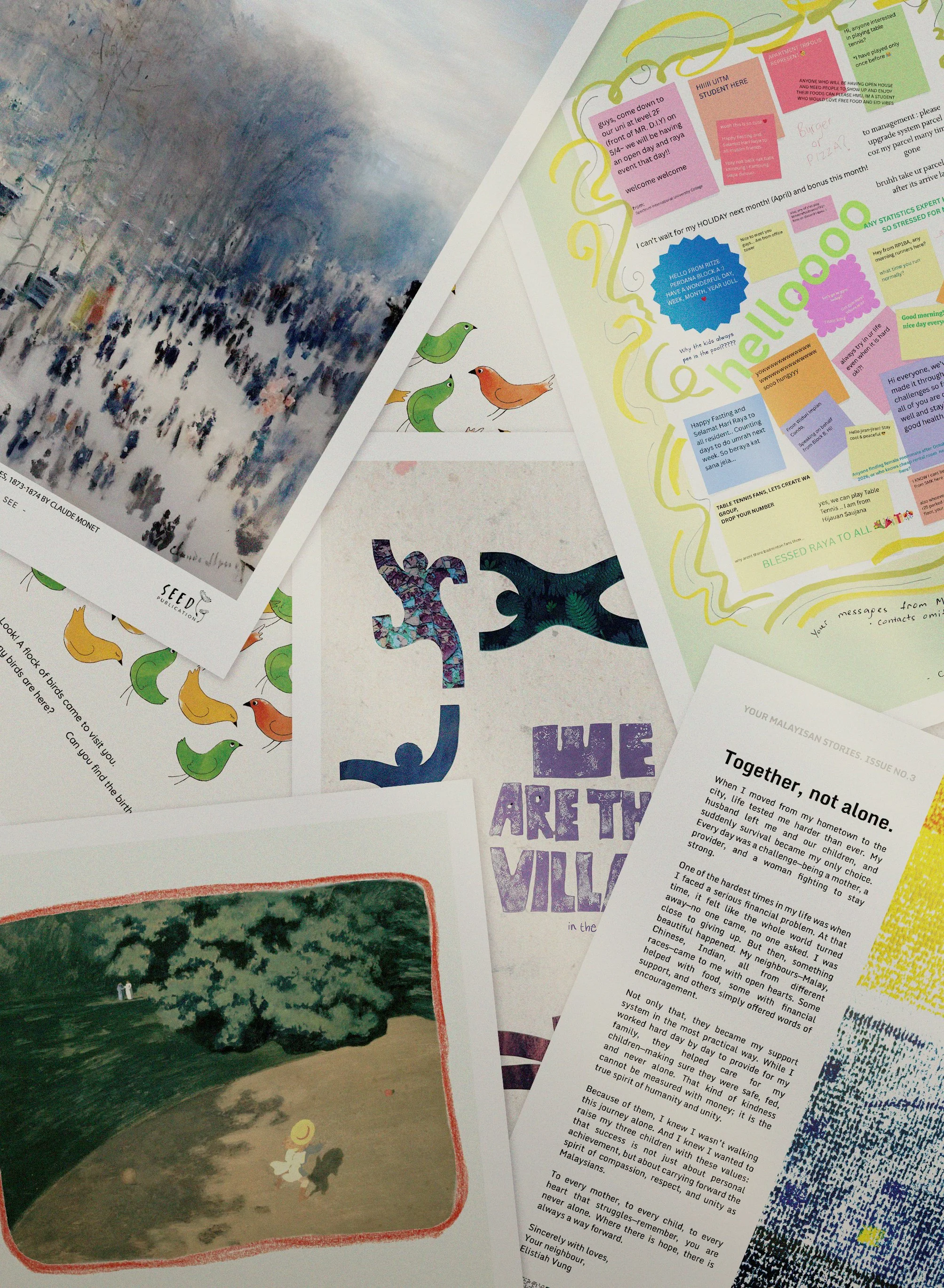 A collection of editorial posters scattered on a table, including a landscape painting, bird illustrations, and various handwritten and printed notes.