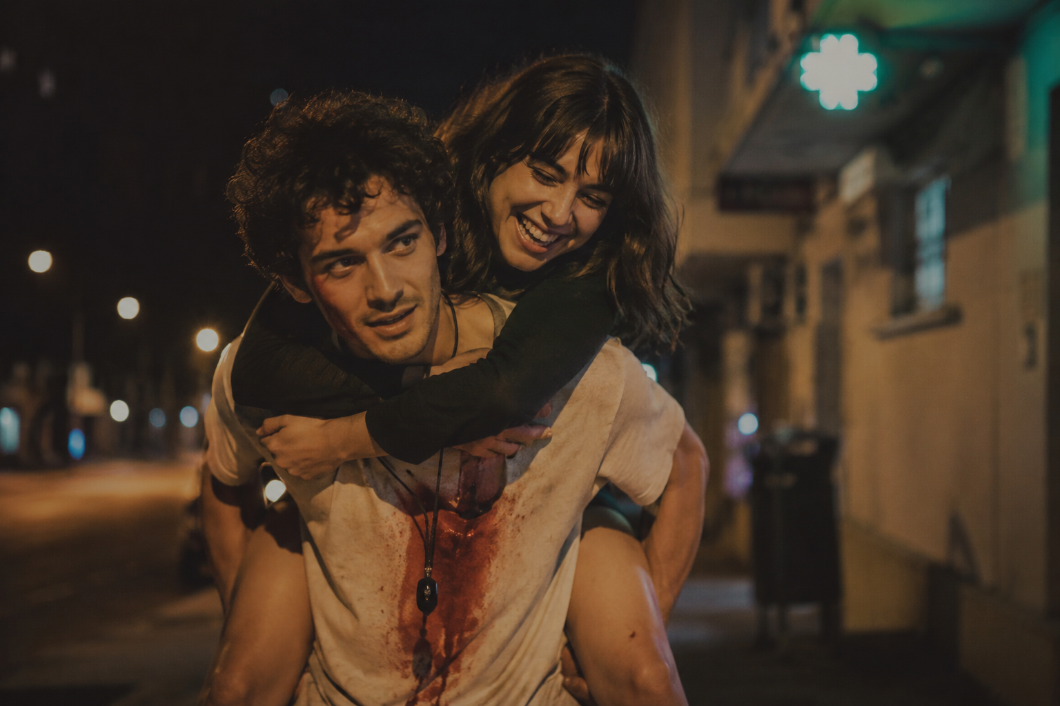 Two characters cross the city at night in Something Has To Die, a dark romantic comedy short film by Daniel Aguilar Liriano.
