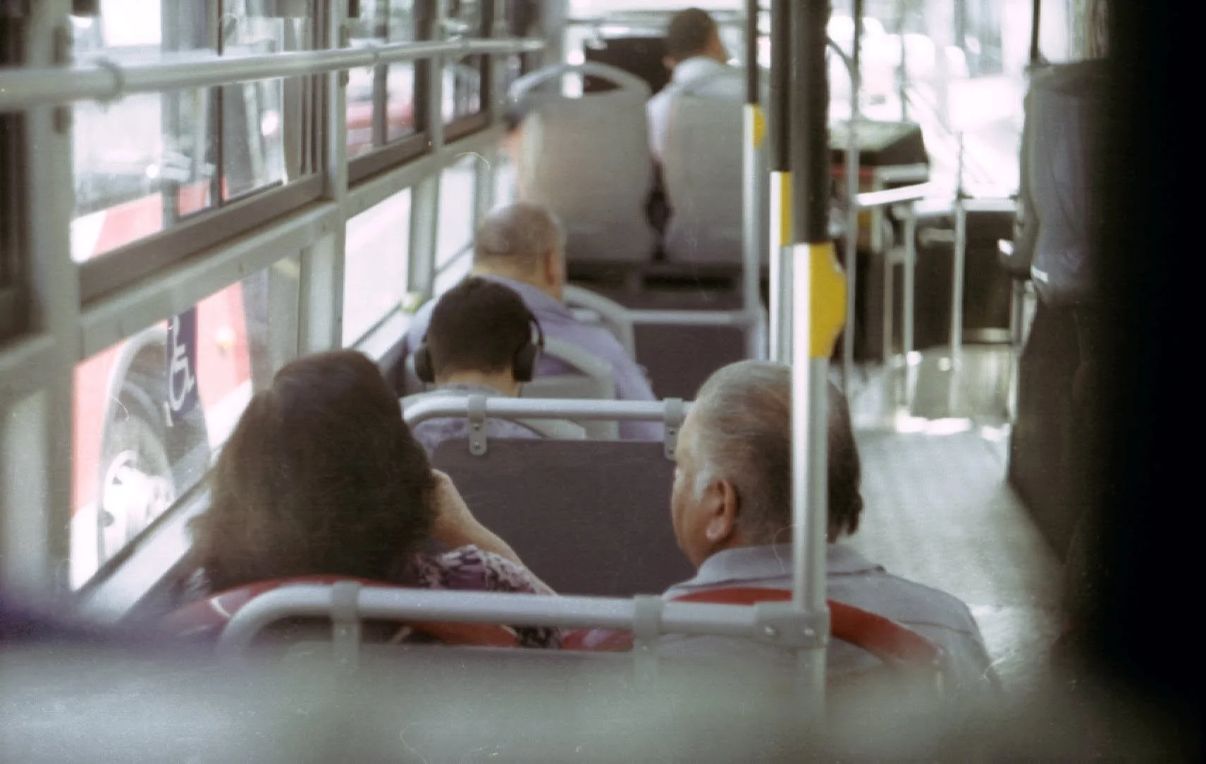Passengers seated inside a city bus during a daily commute