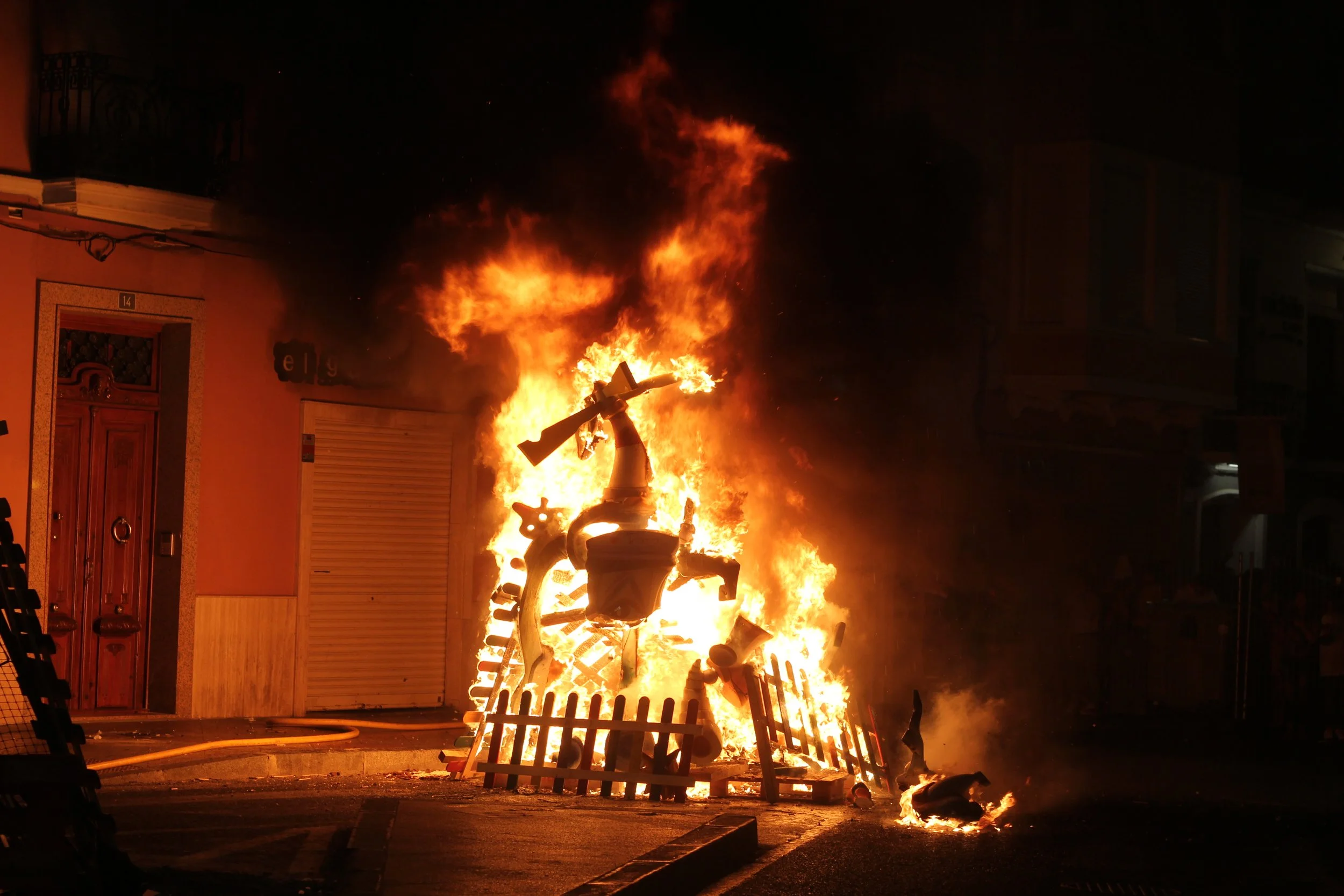 A burning Hoguera monument during Las Hogueras de Alicante, Spain.