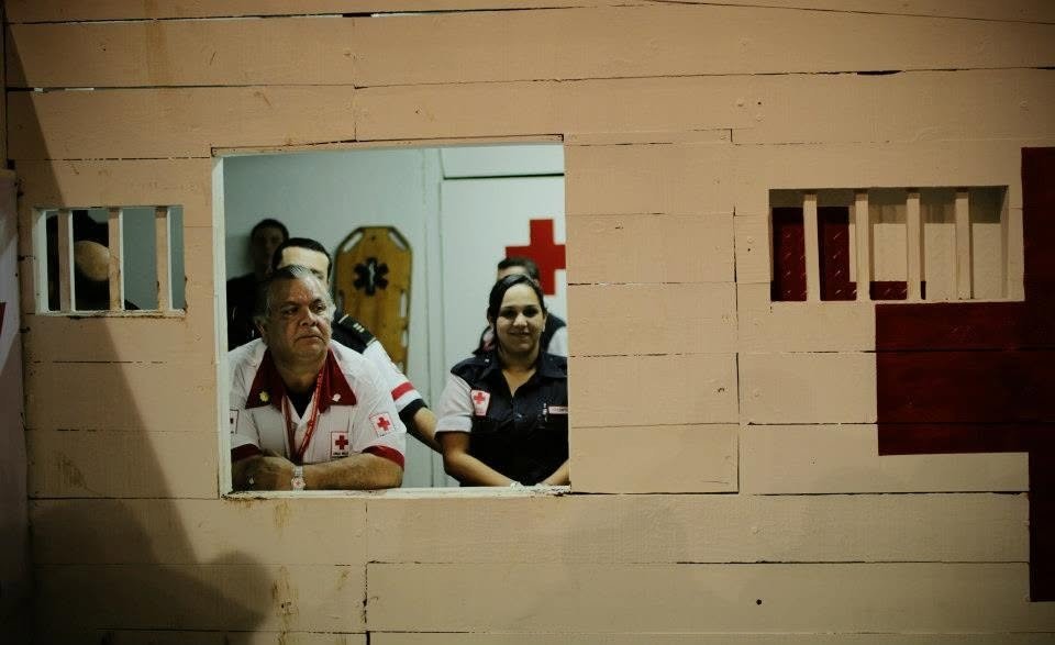 Paramedics watching the festival from inside a building