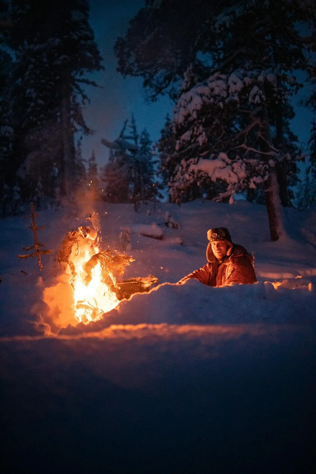 Winter snowshoeing safari and campfire in Oulu, Northern Finland.