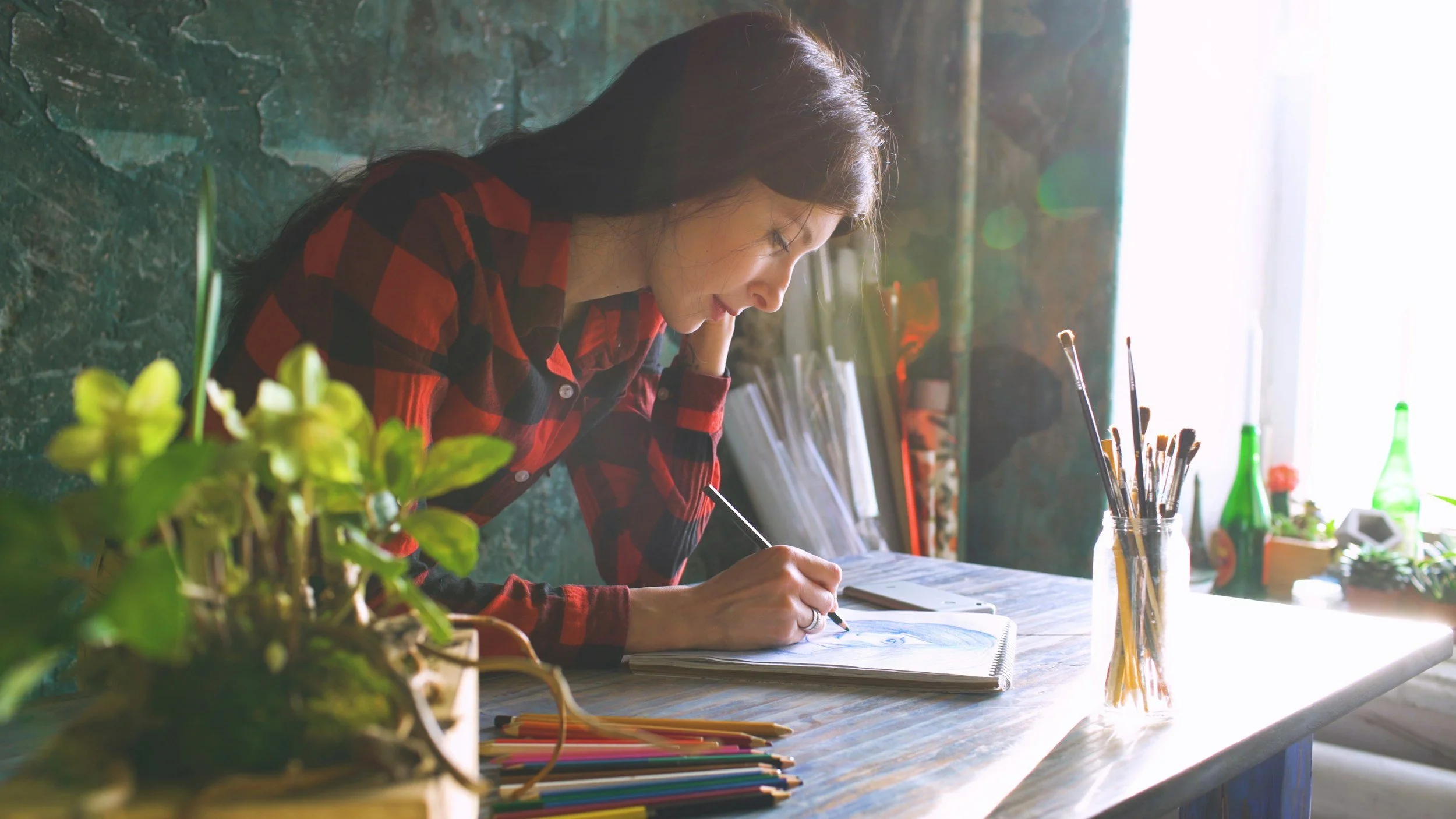 High school student writing an essay for a homeschool pod ELA class