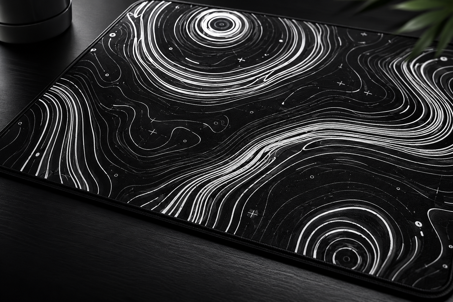 A black Neoprene Mouse Pad surface with white topographical map lines and markings, resembling a stylized map or abstract design.