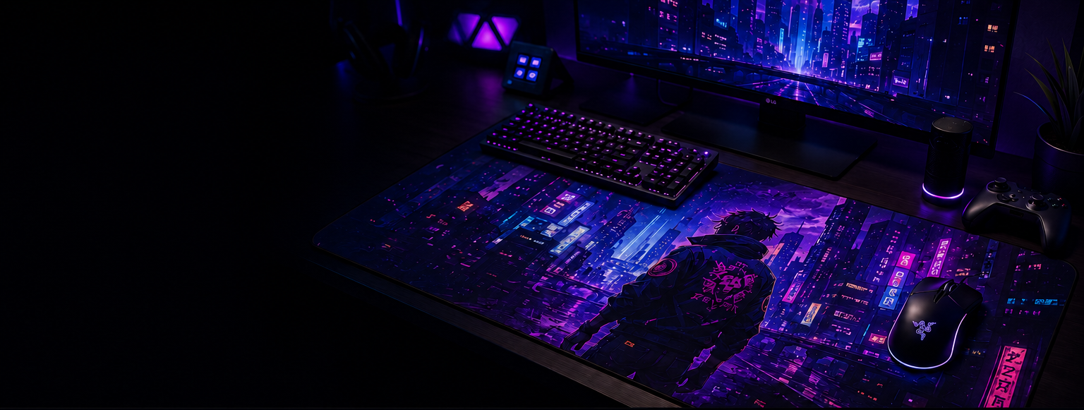 A gaming setup with a large branded mouse pad featuring a futuristic cityscape and a character, a keyboard, a mouse with RGB lighting, a monitor displaying a neon city, a speaker, a gaming controller, and a small plant, all illuminated with purple and blue LED lighting.