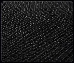 Close-up of a black textured surface with small bumps or dots.