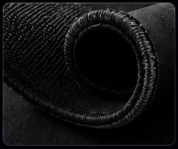 Close-up of a black pan flute with multiple tubes arranged in a circular pattern on a black background.