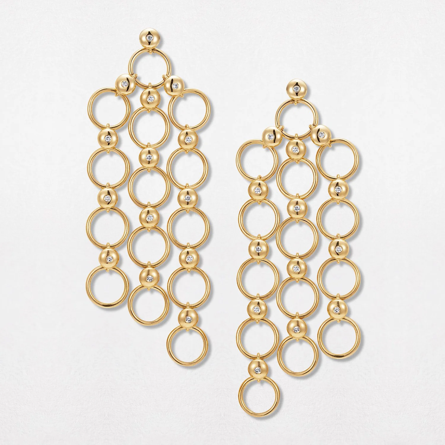 Gold chain chandelier earrings with alternating open circles and studded beads
