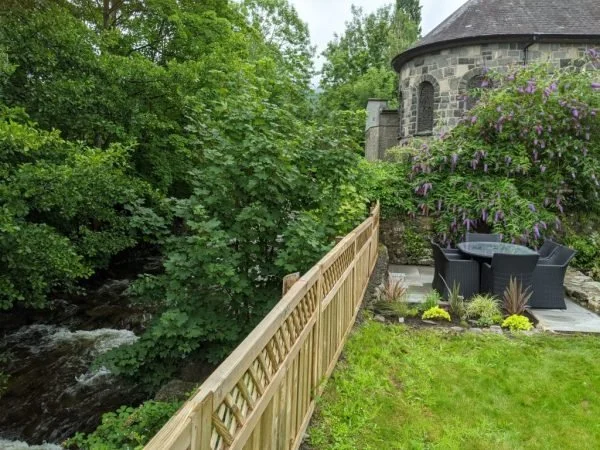Riverside seating area at Dolgellau holiday cottage