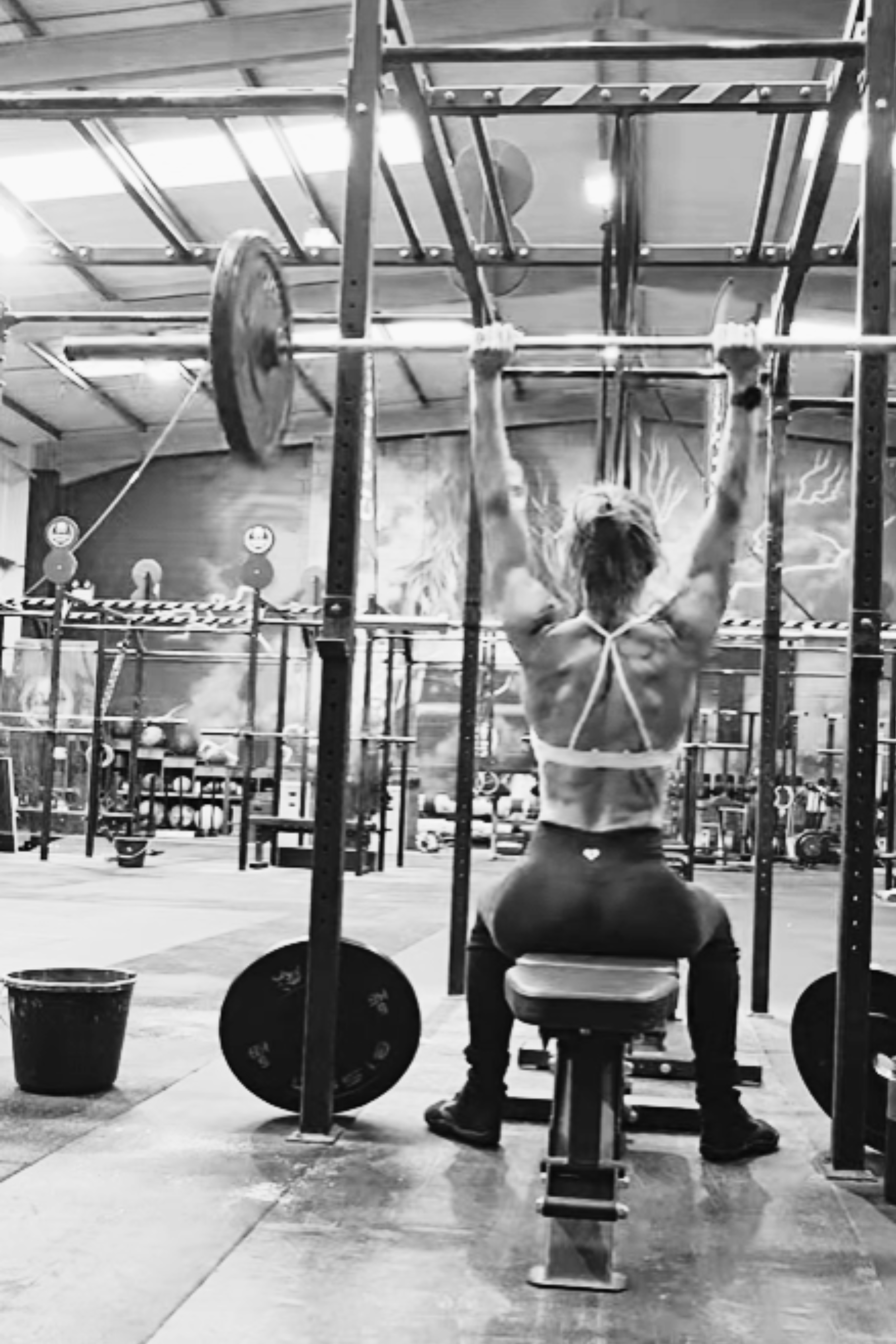 Woman doing a seated press lift