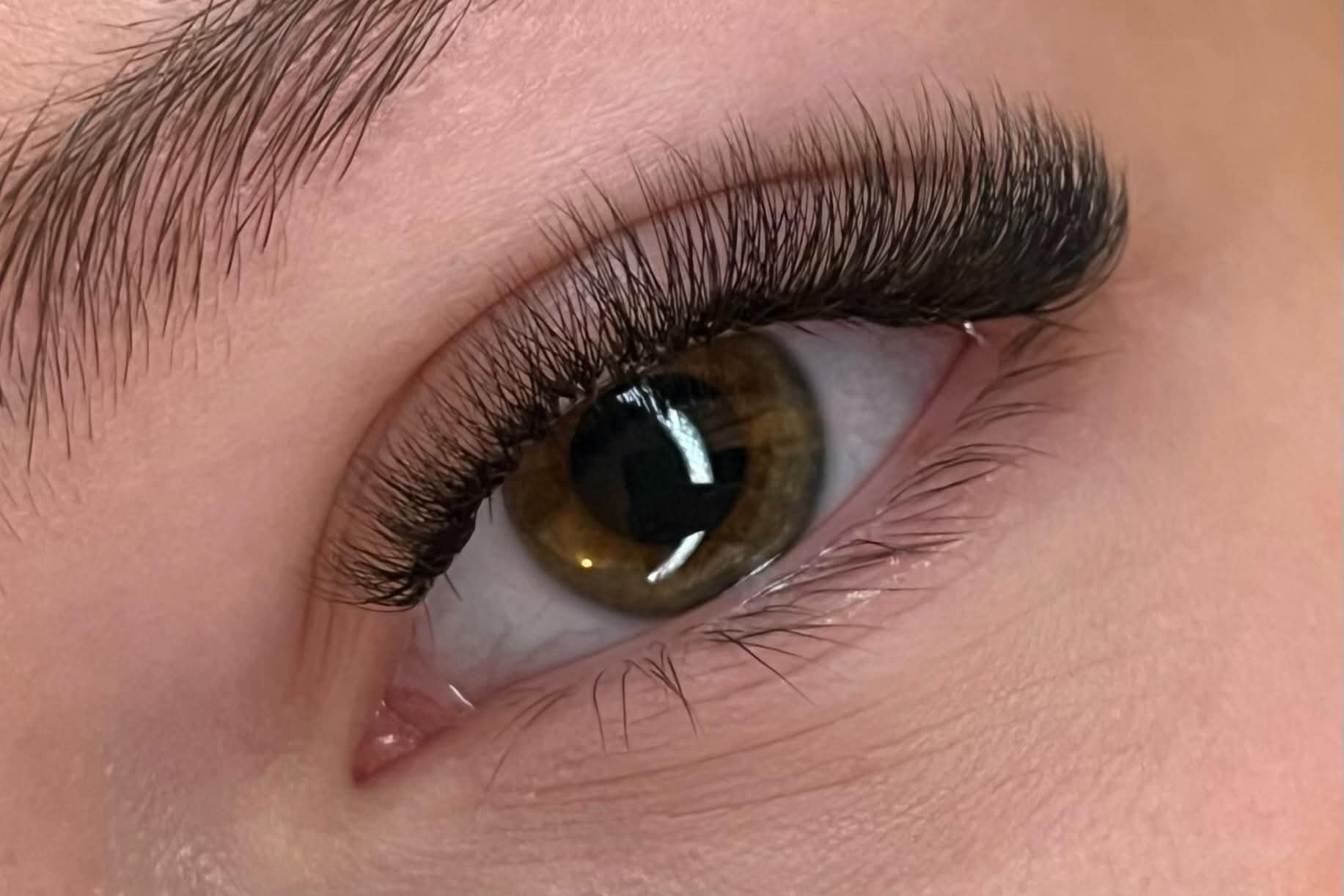 Professional eyelash extension result showing clean placement and styling by lash educator Olga Fleming
