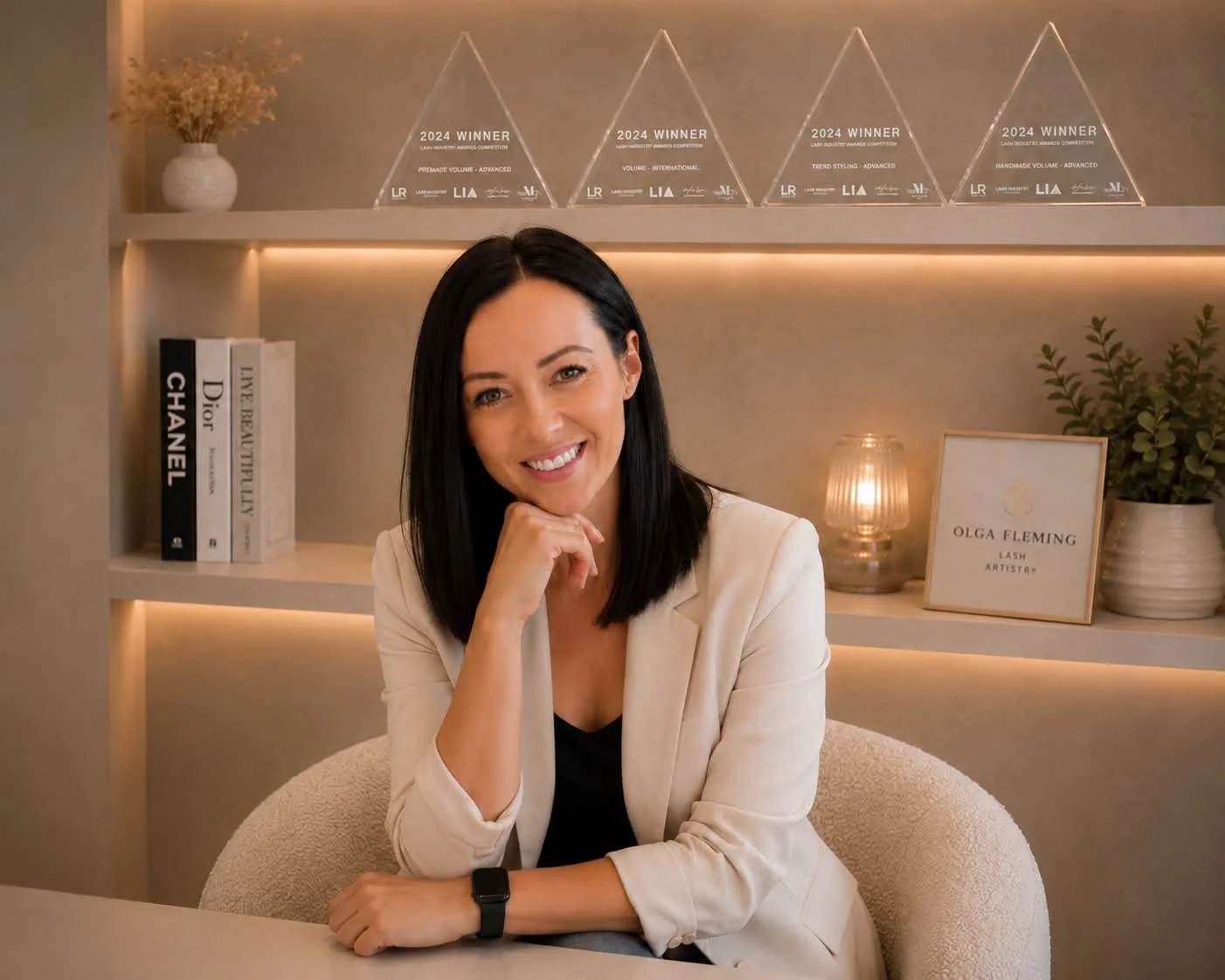 Lash educator Olga Fleming in her Christchurch studio with her NZ lash industry awards
