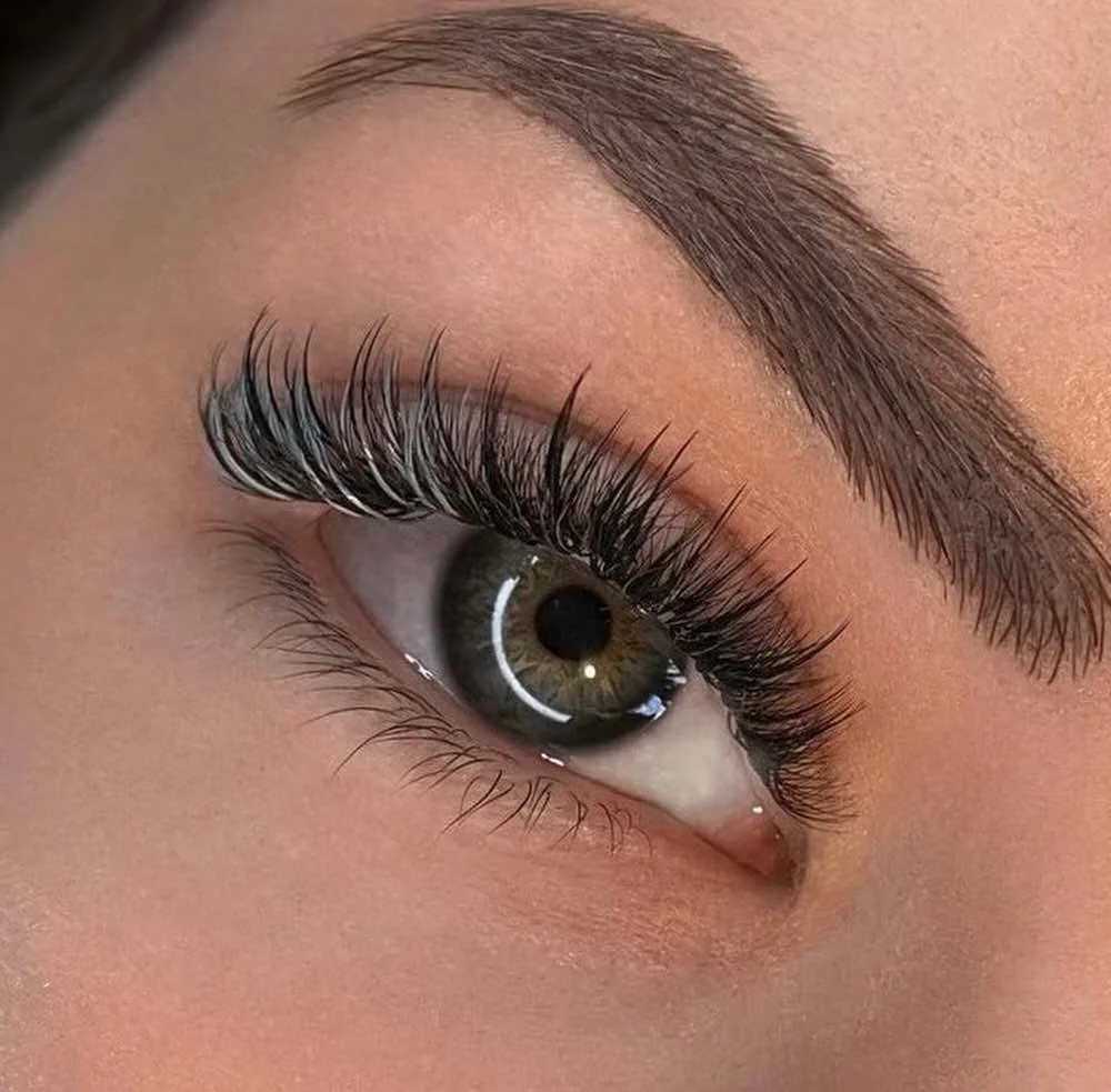 Professional eyelash extension set showing clean attachment, placement and consistent lash direction