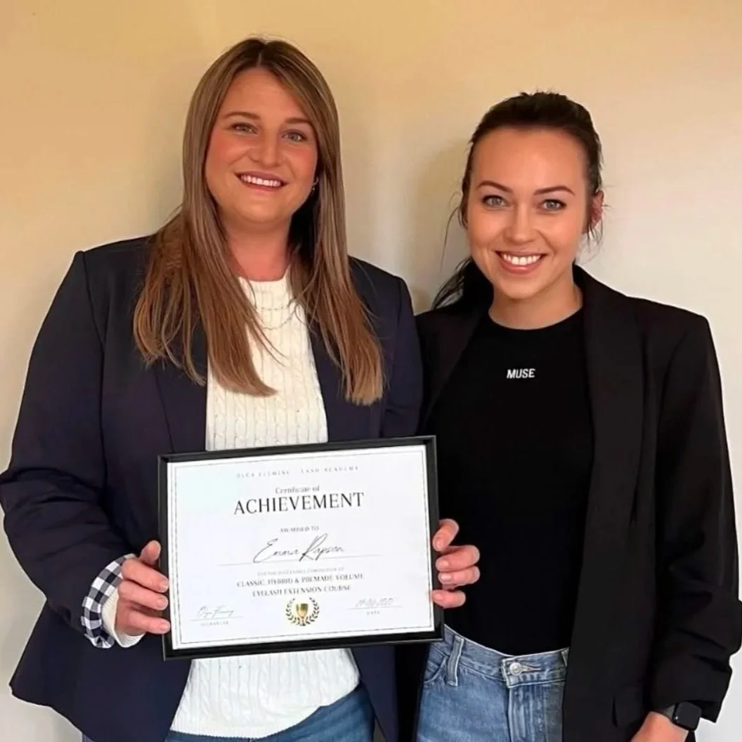 Olga Fleming with lash student Emma holding her training certificate after completing lash training in New Zealand.