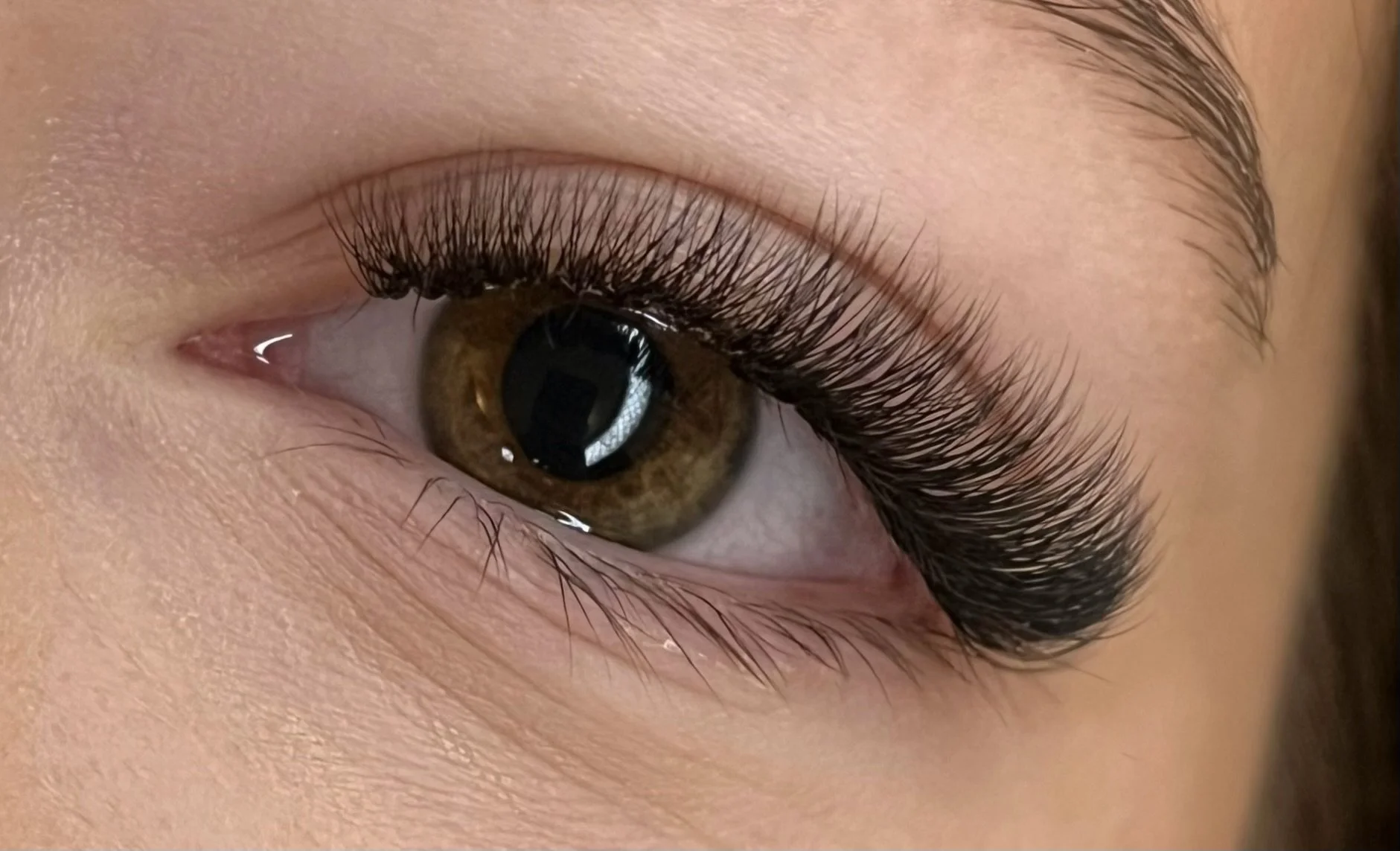 Professional eyelash extension result showing a finished lash set by Olga Fleming