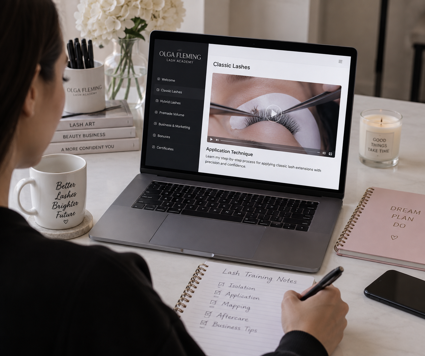 Beginner lash student learning eyelash extension techniques through Olga Fleming’s online lash course