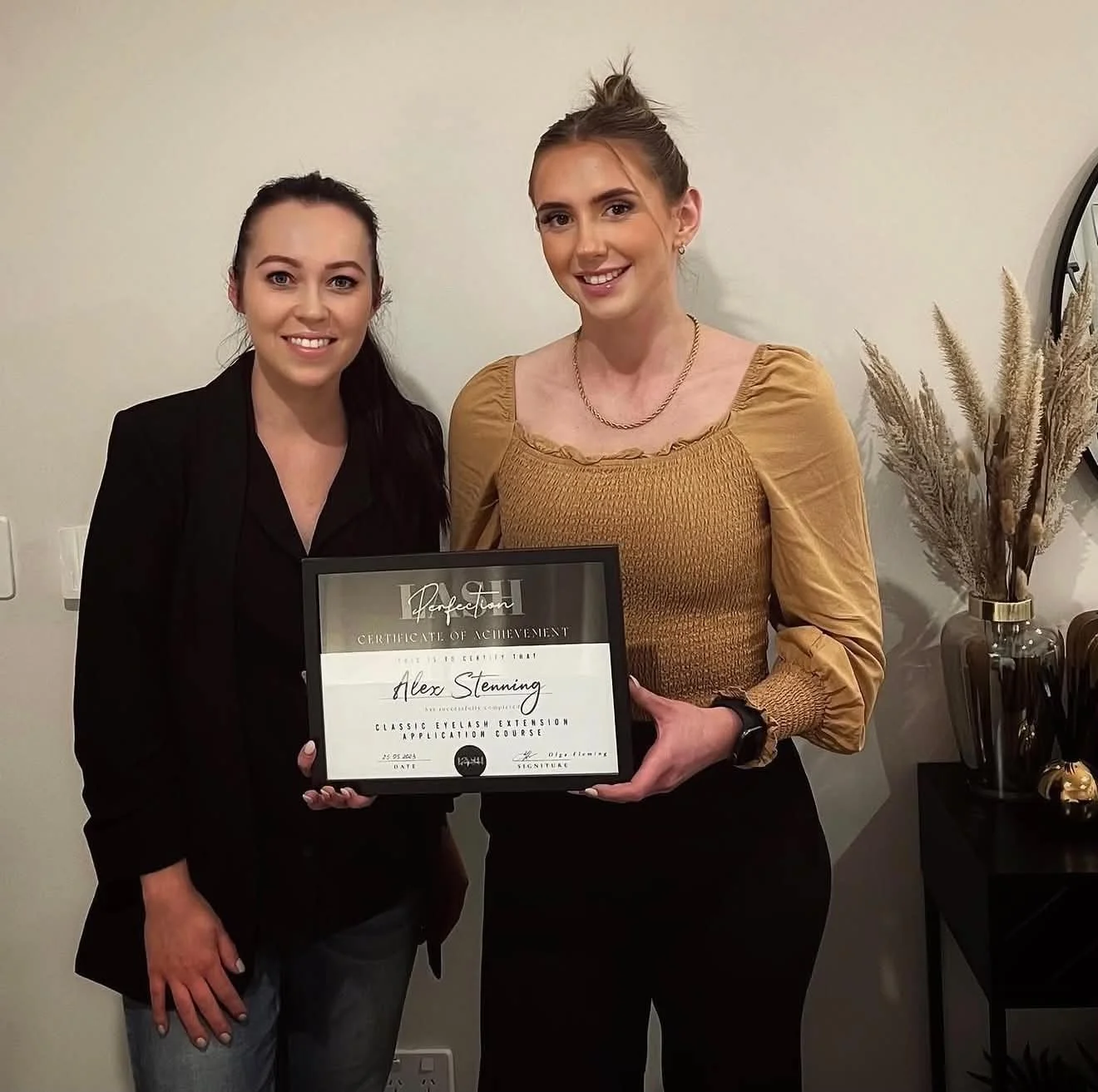 Lash student receiving a Certificate of Completion after professional lash training in Christchurch