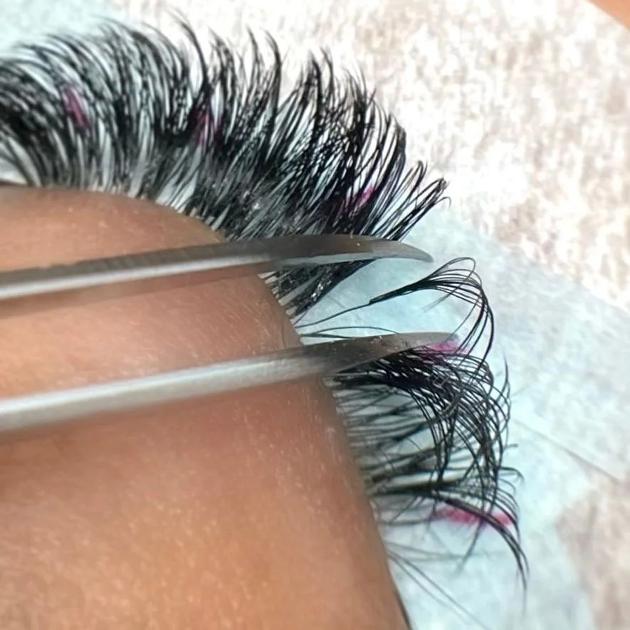 Beginner lash student practising isolation technique during eyelash extension training