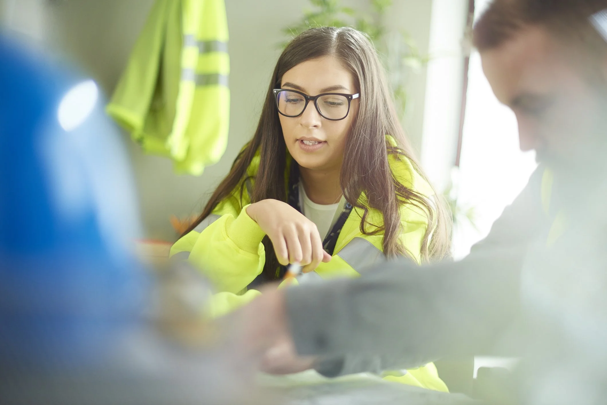 Young woman talking at a team meeting