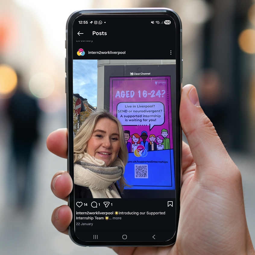 An image of a person holding a phone in their right hand. On the screen is the intern to work instagram showing the branding being used.