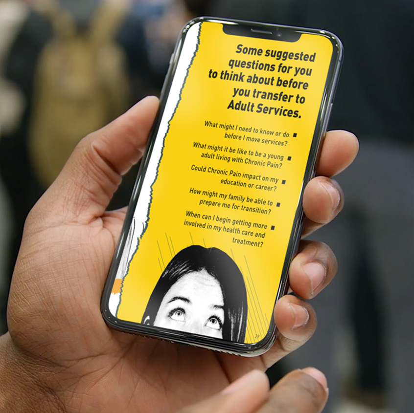 An Image of someone holding their phone in their left hand. The screen shows one of the pages from the book with information about questions to ask before you transition