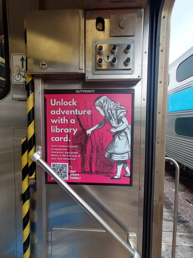Ad featuring Alice in Wonderland in the Metra train car