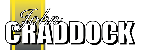 A graphic logo with the name 'John Craddock' in stylized text, featuring yellow, black, and gray colors.