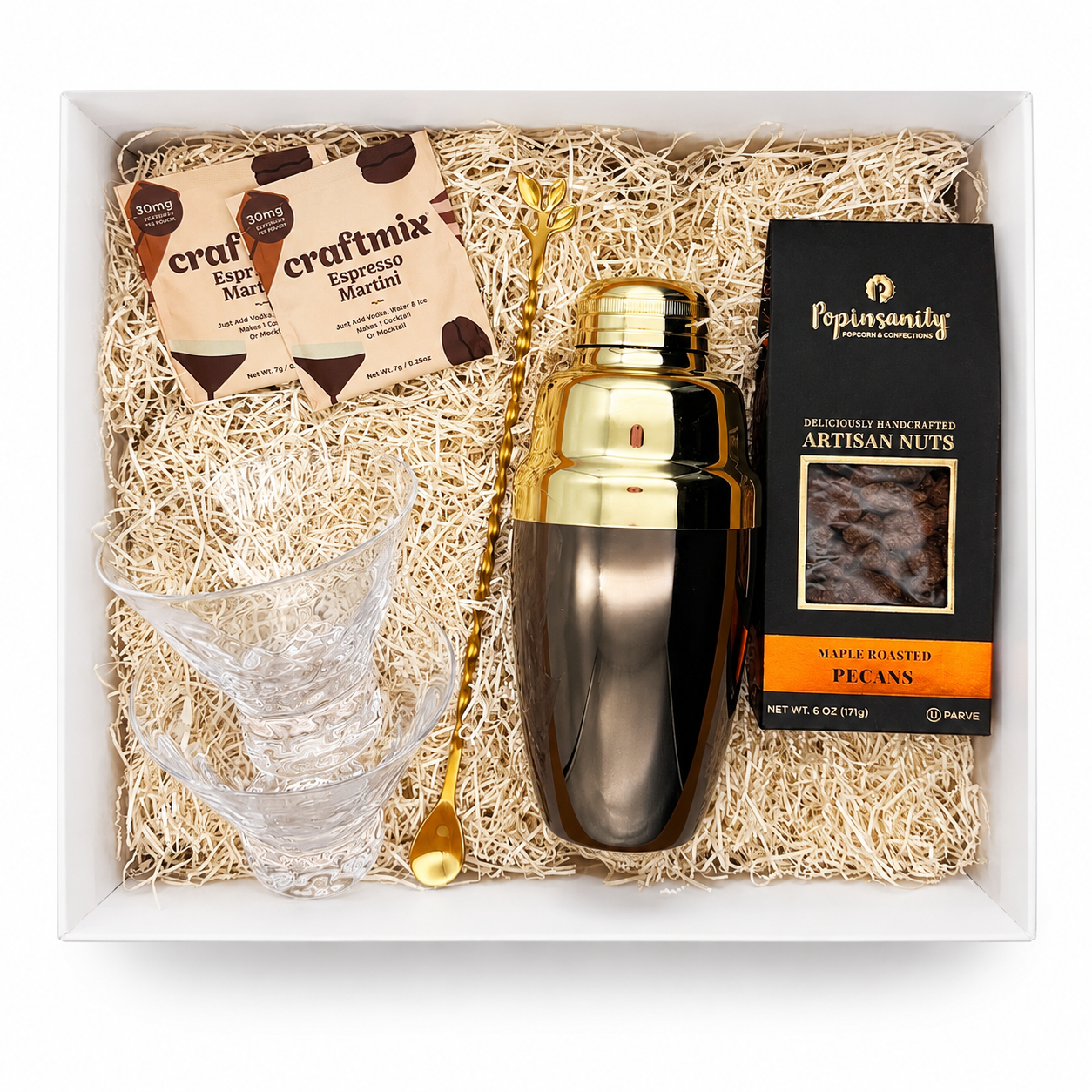 The Nightcap Signature espresso martini gift box with a two-tone cocktail shaker, two crystal martini glasses, espresso martini mixers, gold cocktail spoon, and maple roasted pecans