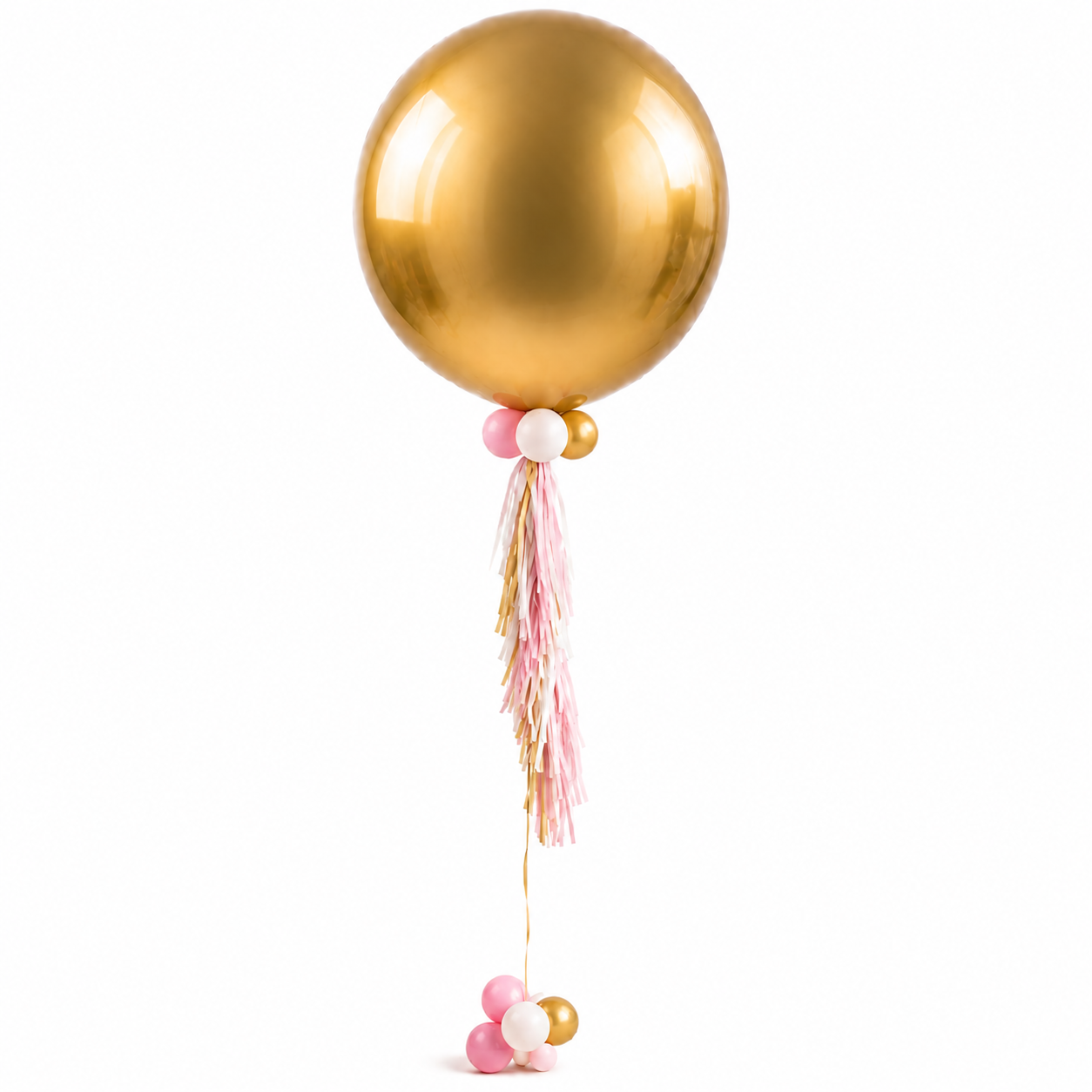 A large, shiny, gold helium balloon attached to a cluster of smaller pink, white, and gold balloons, with pink and white tassels hanging from the string, set against a plain white background.