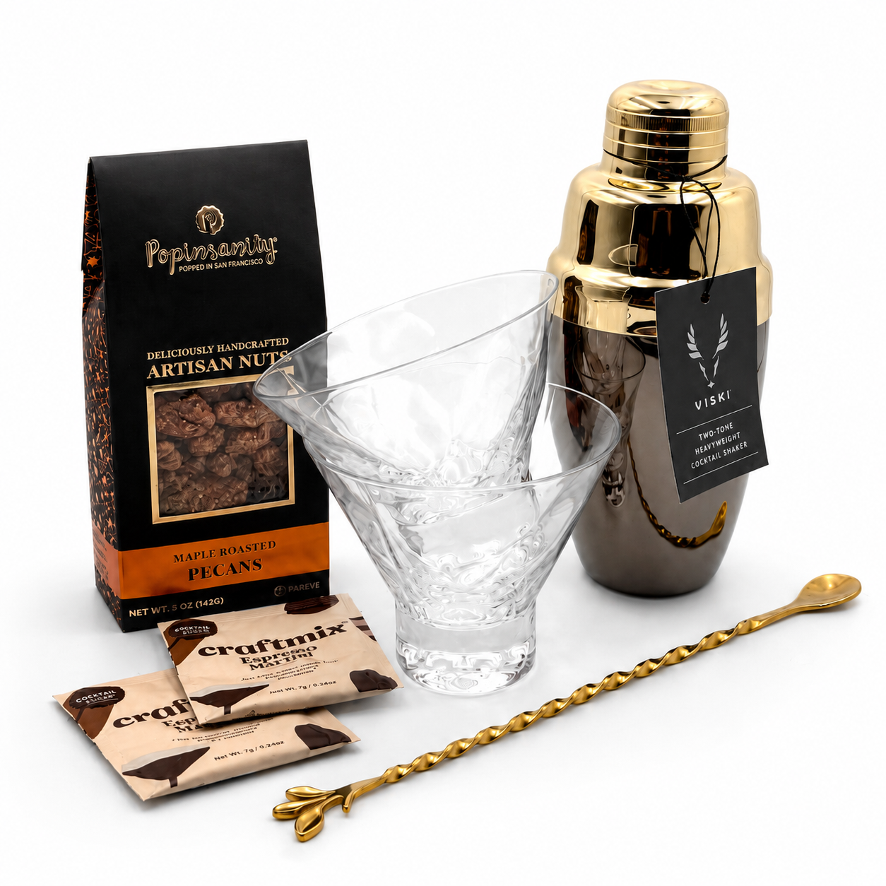 The Nightcap Signature espresso martini gift box with a two-tone cocktail shaker, two crystal martini glasses, espresso martini mixers, gold cocktail spoon, and maple roasted pecans