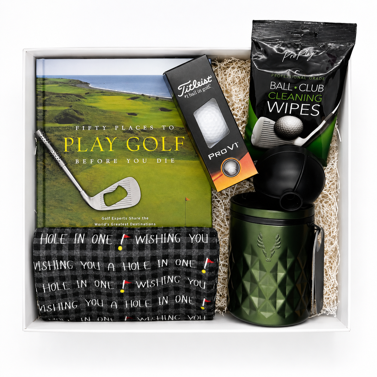 The Lux 19th Hole golf gift box with a satin green Viski rocks tumbler, Titleist Pro V1 golf balls, golf towel, ball ice mold, club bottle opener, and a golf coffee-table book