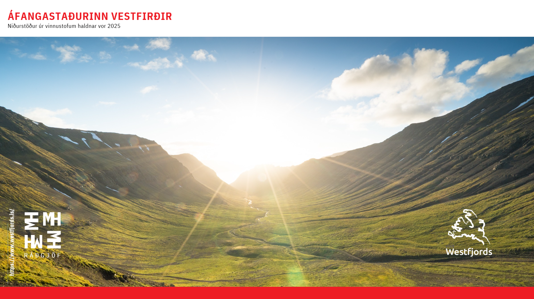 Sun rising over a green valley surrounded by mountains with patches of snow, blue sky, and scattered clouds.