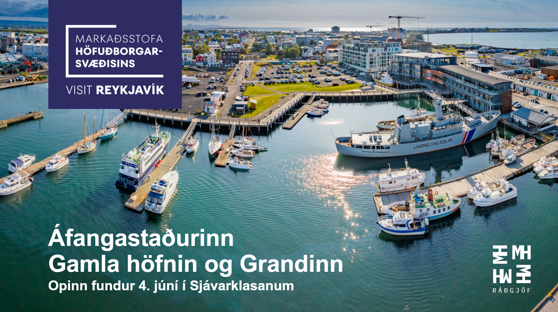 An aerial view of the harbor in Reykjavik, Iceland, with boats docked at the piers, surrounded by modern buildings and a cityscape in the background, under a partly cloudy sky.
