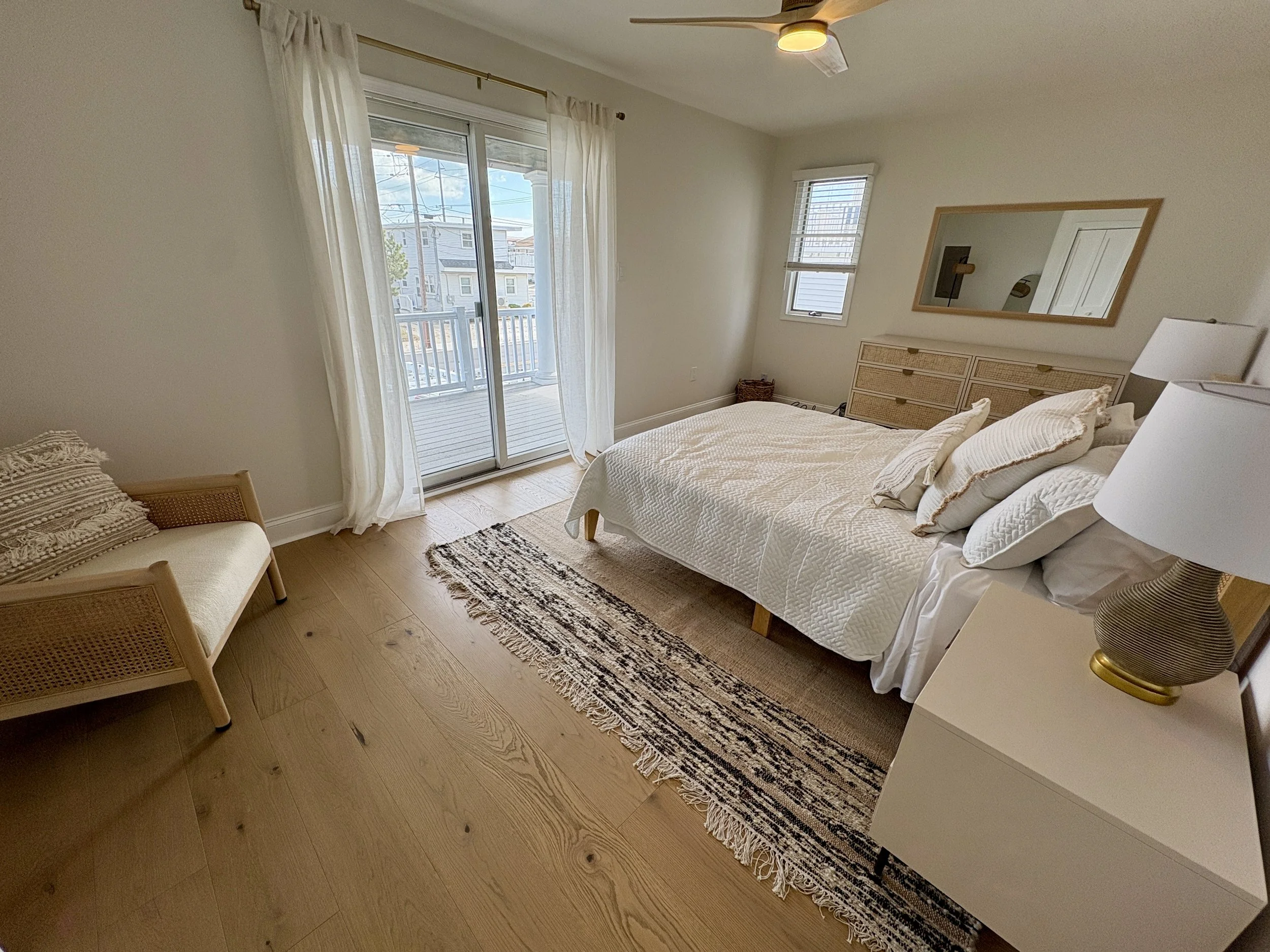 Third bedroom with queen bed and private deck (facing front of house).