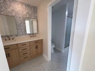Master ensuite with double sink and private enclosed shower and lavatory.