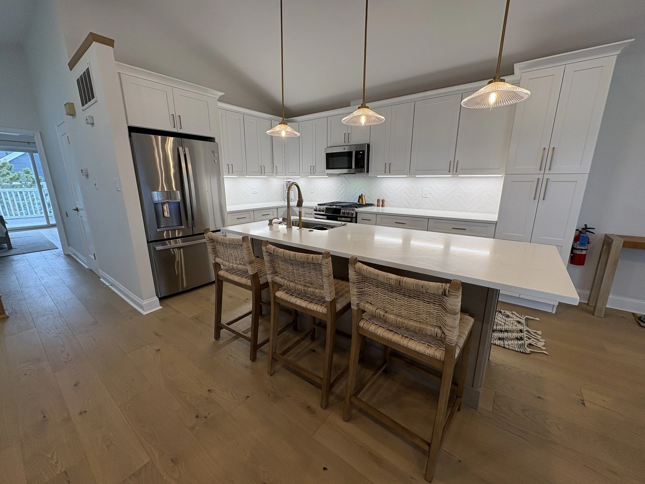 Fully renovated kitchen with new appliances, gas cooking, dishwasher, garbage disposal,  and every conceivable kitchen implement.  There is a kitchen island with seating and a seperate tables and chairs with seating for 6.