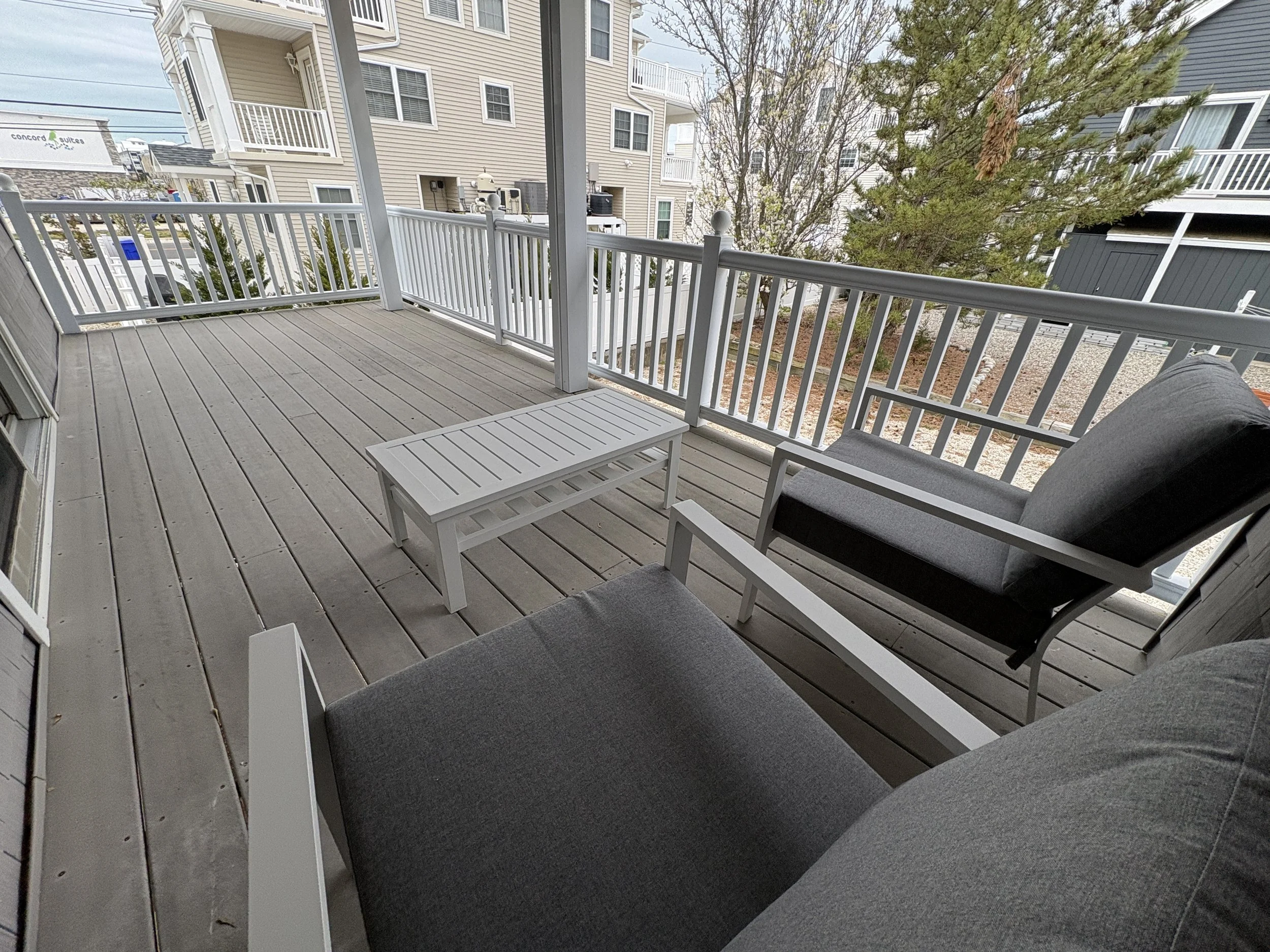 Private deck off second bedroom.  Faces rear yard.