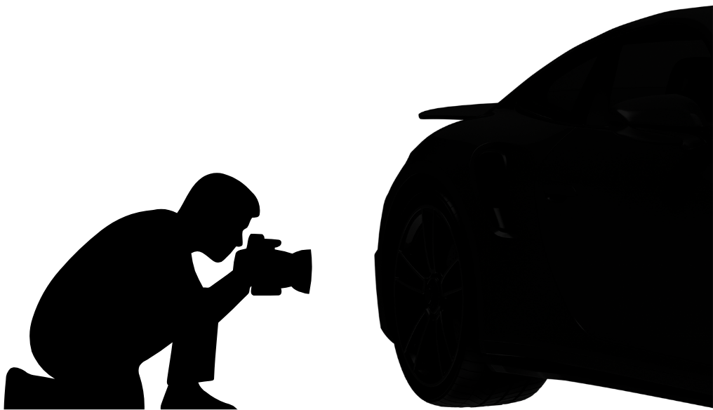 Es ist ein dunkles Bild eines Autos, bei dem nur ein Teil sichtbar ist, darunter ein Reifen. Das Auto ist fast vollständig im Schatten.