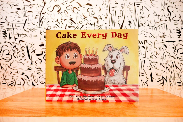 The Cake Every Day hardcover standing on a wooden table