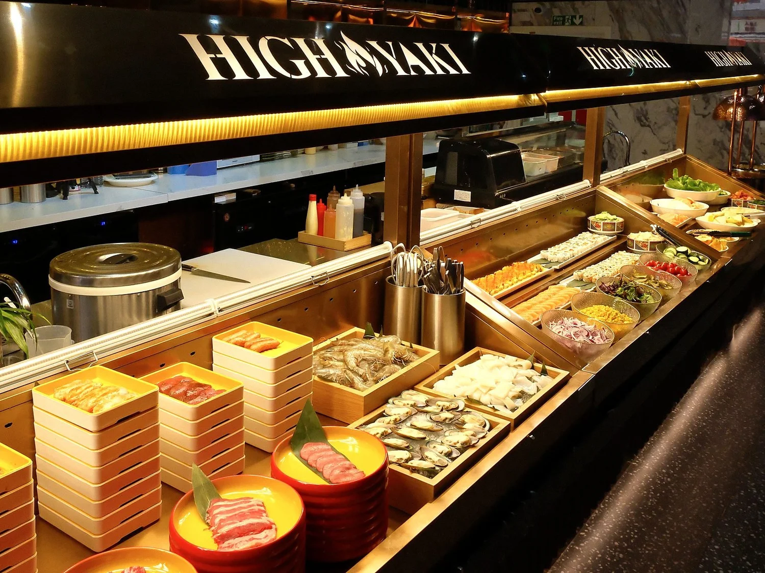 High Yaki all-you-can-eat buffet counter with BBQ meats, seafood and sushi