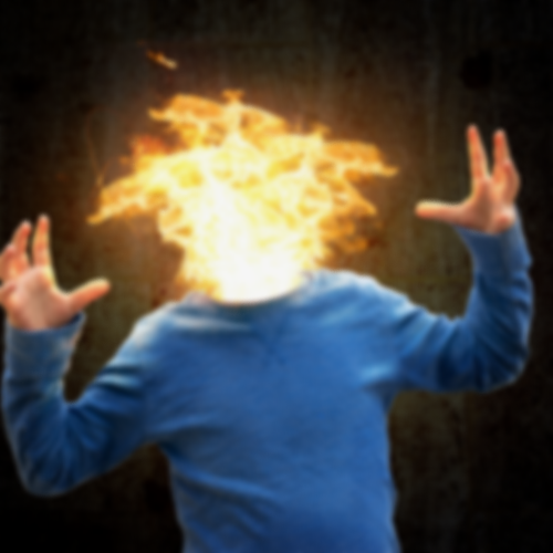 Person with head on fire wearing a blue hoodie making a gesture with hands