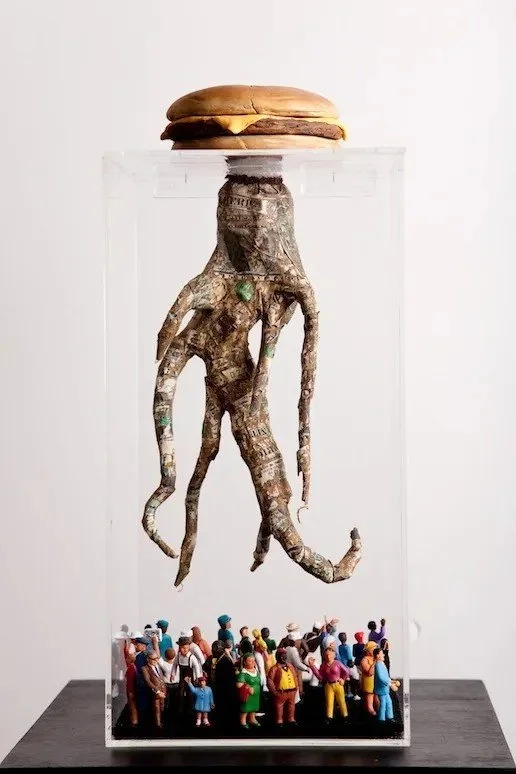 Digesting Capital  22"x6"x6"   Mixed Media